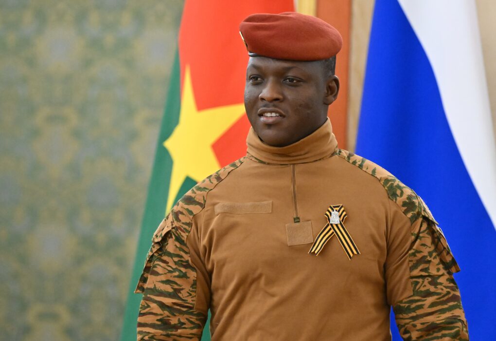 Captain Ibrahim Traoré in front of Burkina Faso's flag.